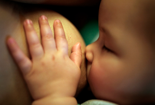 GRANITE FALLS, NC - December 7 - Seventh-month old Salema Silva breast-feeds on her mother, Melissa Silva, in their home in Granite Falls, North Carolina on December 7, 2007.